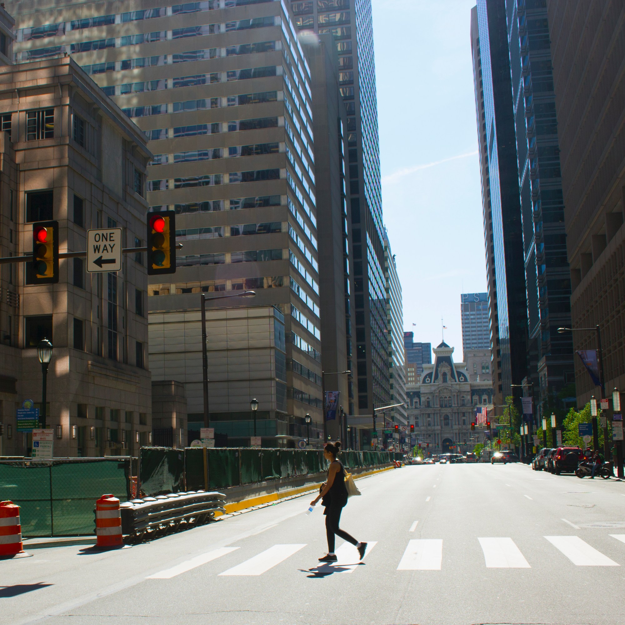 Woman crossing West Market Street in Center CIty Philadelphia