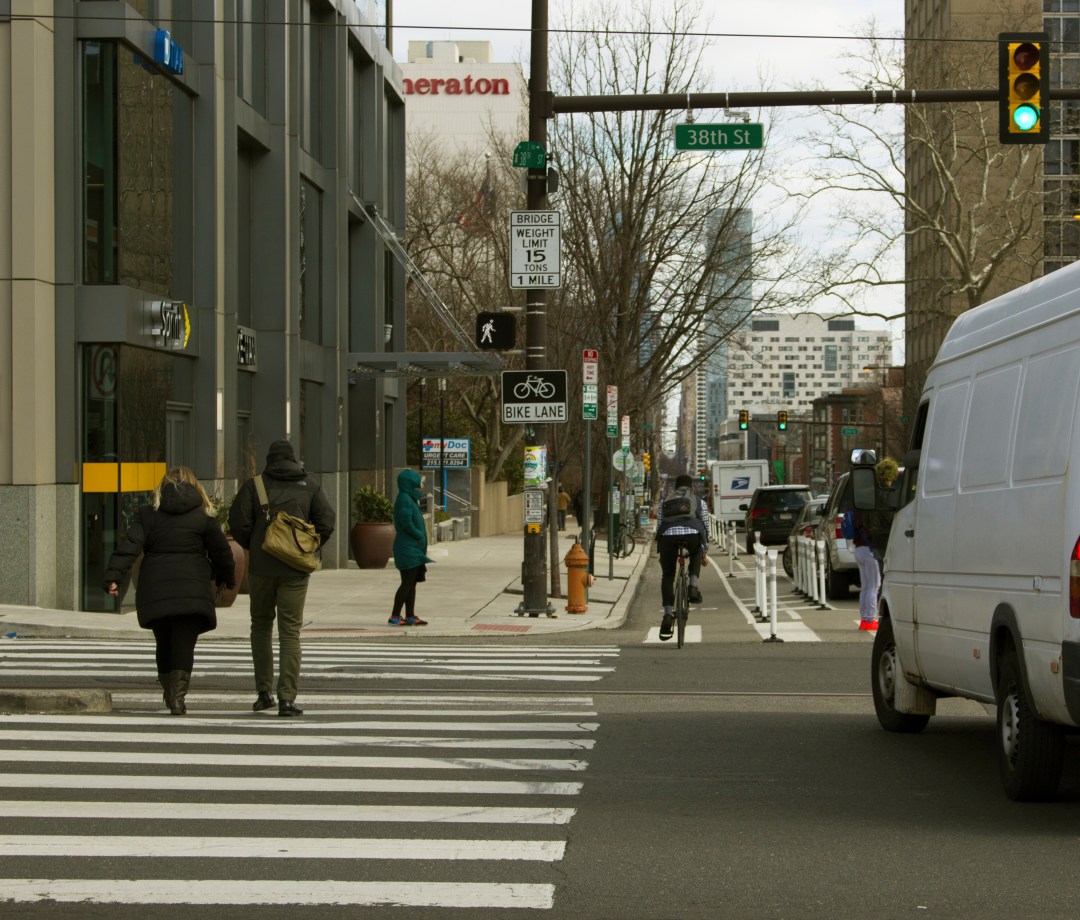 People in crosswalk at 38th and Chestnut Streets in West Philadelphia